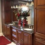 CUSTOM DOUBLE VANITY WITH LINEN STORAGE. HAND RUBBED MAPLE.